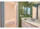 A bright bathroom with a white sink and a bathtub at 4718 Nara Vista Way # 104, Las Vegas, NV 89103