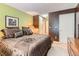 A warmly decorated bedroom with a view towards the closet and bathroom at 4718 Nara Vista Way # 104, Las Vegas, NV 89103