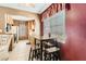 Kitchen with wooden cabinets, tiled floor, and eat-in table at 4718 Nara Vista Way # 104, Las Vegas, NV 89103