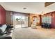 Bright living room featuring a sliding glass door that leads to the outdoor balcony at 4718 Nara Vista Way # 104, Las Vegas, NV 89103