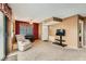 Cozy living room with carpet, tiled dining area, and front door at 4718 Nara Vista Way # 104, Las Vegas, NV 89103