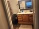 Bathroom with a wooden vanity, a large mirror, and modern fixtures at 4730 E Craig Rd # 1155, Las Vegas, NV 89115