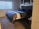 Comfortable bedroom with plush carpeting, a large window, and neutral decor at 4730 E Craig Rd # 1155, Las Vegas, NV 89115