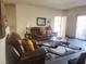 Inviting living room with a comfortable leather sofa and decorative rug at 4730 E Craig Rd # 1155, Las Vegas, NV 89115