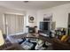 Open concept living room with hardwood floors, fireplace, and media center at 4730 E Craig Rd # 1155, Las Vegas, NV 89115