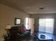Comfortable living room featuring hardwood floors, leather seating, and natural light at 4730 E Craig Rd # 1155, Las Vegas, NV 89115