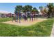 Community playground with colorful equipment and mature shade trees at 4730 E Craig Rd # 1155, Las Vegas, NV 89115