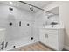 Modern bathroom featuring a frameless glass shower, white vanity, and contemporary fixtures at 4805 Jay Ave, Las Vegas, NV 89130