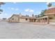 Spacious single-story home featuring a large concrete patio, brick accents, and a welcoming covered area at 4805 Jay Ave, Las Vegas, NV 89130