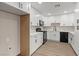 Updated kitchen with modern appliances and white cabinets at 4805 Jay Ave, Las Vegas, NV 89130