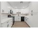 Updated kitchen with modern appliances and clean white cabinets at 4805 Jay Ave, Las Vegas, NV 89130
