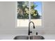 Bright kitchen sink with large window letting in plenty of natural light at 4805 Jay Ave, Las Vegas, NV 89130
