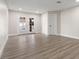 Bright living room with laminate flooring, recessed lighting and double doors leading to the patio at 4805 Jay Ave, Las Vegas, NV 89130