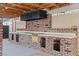 Outdoor kitchen with brick construction, including a built-in oven, countertop space, and storage at 4805 Jay Ave, Las Vegas, NV 89130