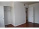 Bedroom features a closet, fresh paint, and sleek hard wood floors at 5185 Indian River Dr # 223, Las Vegas, NV 89103