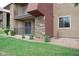 A nice building exterior with stone accents, a private patio, and mature landscaping at 5185 Indian River Dr # 223, Las Vegas, NV 89103