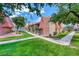 Exterior of the townhome features well-manicured landscaping, walkways, and a building with multiple levels and balconies at 5185 Indian River Dr # 223, Las Vegas, NV 89103