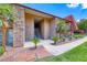 Beautifully landscaped condominium with a stone accent exterior, walkways, lush vegetation, and ample parking for residents at 5185 Indian River Dr # 223, Las Vegas, NV 89103