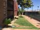 Building with stone accents, exterior patio, and landscaping at 5185 Indian River Dr # 223, Las Vegas, NV 89103