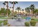 Common area with a seating area, lush trees, and manicured landscaping creating a serene outdoor setting at 5185 Indian River Dr # 223, Las Vegas, NV 89103