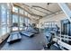 Well-lit fitness center with treadmills, weights, and floor-to-ceiling windows overlooking the pool at 5185 Indian River Dr # 223, Las Vegas, NV 89103