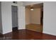 Cozy living room with wood floors, an open closet, and views into an adjacent dining area at 5185 Indian River Dr # 223, Las Vegas, NV 89103