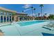 View of the community pool featuring lounge chairs, blue water, and a covered area at 5185 Indian River Dr # 223, Las Vegas, NV 89103