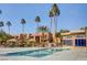 Community pool with poolside awnings, clear water, and lush landscaping at 5185 Indian River Dr # 223, Las Vegas, NV 89103