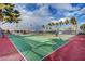 Outdoor tennis court with net and fencing, surrounded by landscaping at 5185 Indian River Dr # 223, Las Vegas, NV 89103