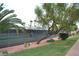 Beautiful view of the tennis courts with mature trees and landscaping at 5185 Indian River Dr # 223, Las Vegas, NV 89103