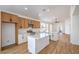 Open kitchen with island, stainless appliances, and wood floors at 5321 Marietta Ave, Las Vegas, NV 89108
