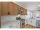 Contemporary kitchen with quartz counters and stainless steel appliances at 5321 Marietta Ave, Las Vegas, NV 89108