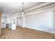Bright living room featuring wood floors, an island, and modern lighting at 5321 Marietta Ave, Las Vegas, NV 89108