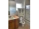 Bathroom showing the sink, mirror, toilet with bidet and decorative glass shower-tub combo at 5334 Floating Flower Ave, Las Vegas, NV 89139