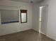 Bedroom with a window, mirror, and doorway, offering a bright and adaptable living space at 5334 Floating Flower Ave, Las Vegas, NV 89139