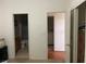 View of the bedroom that leads to the bathroom and a laundry room space at 5334 Floating Flower Ave, Las Vegas, NV 89139