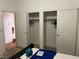 Bedroom featuring closet space, ensuite bathroom and laminated flooring at 5334 Floating Flower Ave, Las Vegas, NV 89139