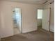 Neutral carpeted bedroom featuring ensuite bathroom and additional room at 5334 Floating Flower Ave, Las Vegas, NV 89139
