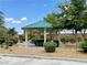 Green gazebo with picnic table and landscaping, offering a relaxing outdoor space at 5334 Floating Flower Ave, Las Vegas, NV 89139