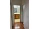 Hallway featuring wood flooring with a view of a bathroom with a wood vanity at 5334 Floating Flower Ave, Las Vegas, NV 89139