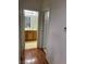 Hallway featuring wood flooring with a view of a bathroom with a wood vanity at 5334 Floating Flower Ave, Las Vegas, NV 89139