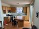 Traditional kitchen with wood cabinets, stainless steel appliances, and a convenient center island at 5334 Floating Flower Ave, Las Vegas, NV 89139