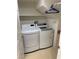 The laundry room has a side by side washer and dryer, and upper shelf for storage at 5334 Floating Flower Ave, Las Vegas, NV 89139