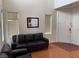 Cozy living room with dark brown couch and high ceilings at 5334 Floating Flower Ave, Las Vegas, NV 89139