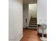 Carpeted stairway featuring wood-look laminate flooring in the entryway at 5334 Floating Flower Ave, Las Vegas, NV 89139
