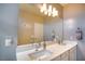 Bathroom with double vanity, white cabinets, and quartz countertops at 541 Tokopah Falls St, Las Vegas, NV 89138
