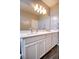 Bathroom with double vanity, white cabinets, and quartz countertops at 541 Tokopah Falls St, Las Vegas, NV 89138