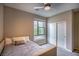 Cozy bedroom with carpet flooring, ceiling fan, and natural light at 541 Tokopah Falls St, Las Vegas, NV 89138
