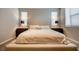 Bedroom with carpet, a large window, and bedside tables with lamps on each side of the bed at 541 Tokopah Falls St, Las Vegas, NV 89138