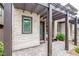 Charming front entrance with stone accents, a pergola, and a neatly paved walkway leading to the front door at 541 Tokopah Falls St, Las Vegas, NV 89138